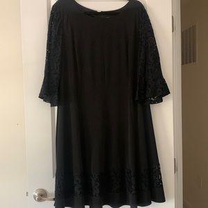 Like new black mid length dress with lace detail on arms and bottom of dress